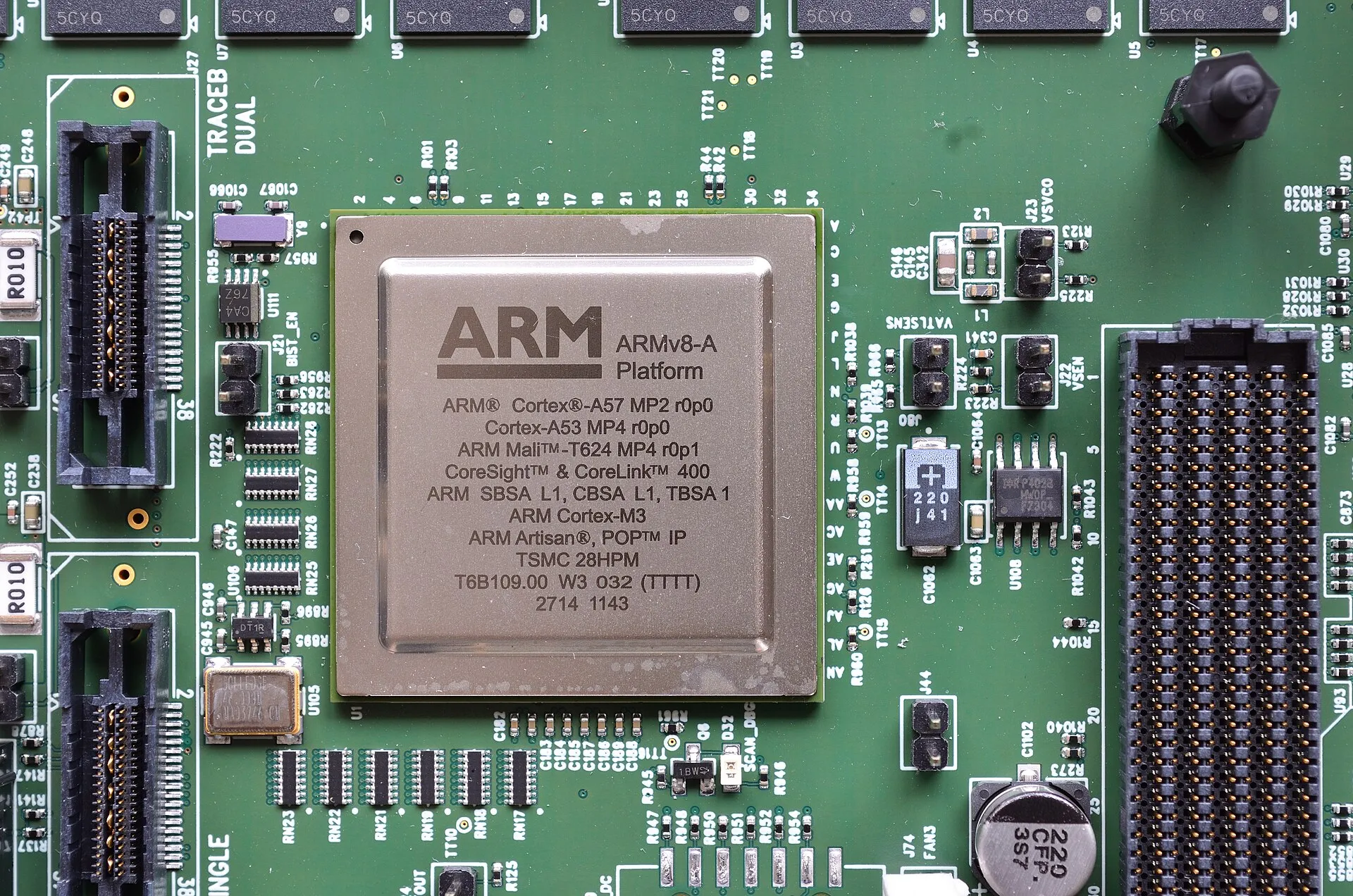 An ARM test chip on a green circuit board, its lid printed with the ARM logo and "ARMv8-A Platform, Cortex-A57 and Cortex-A53".